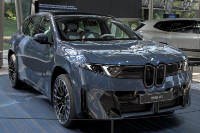 Front and side view of electric SUV with modern LED headlights and aerodynamic shape
