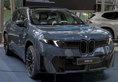 Front view with LED headlights of modern electric SUV
