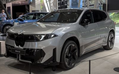 Sleek electric SUV with bold front grille and aerodynamic alloy wheels