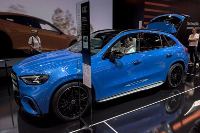 Blue luxury SUV with black rims and modern headlights