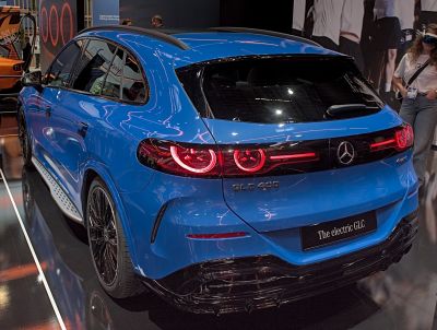 Rear view of SUV with circular LED taillights and sleek blue body