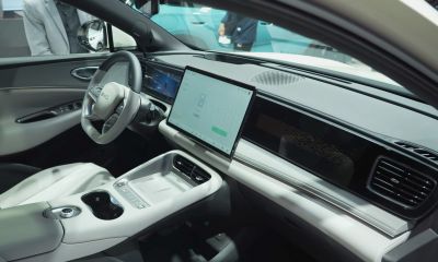 Modern car interior with large central touchscreen and sleek dashboard.