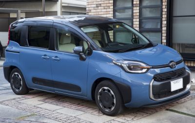 Compact MPV with sliding doors and modern two-tone side profile.