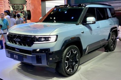 Front-side view of SUV with modern grille and LED headlights