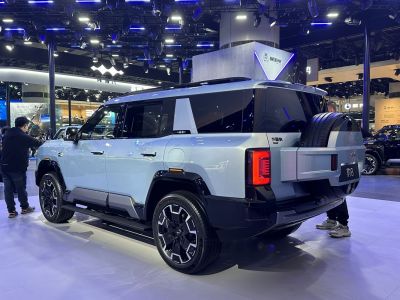 SUV rear and side view featuring rear-mounted spare tire and modern angular design