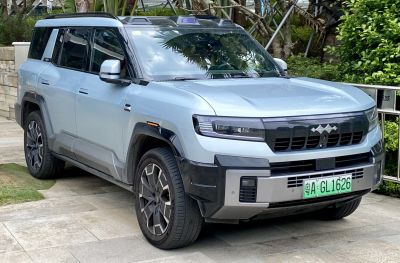 Front view of modern SUV with unique grille and integrated headlights