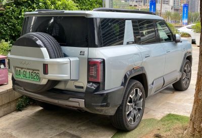 Modern SUV rear design with mounted spare tire and sleek taillights
