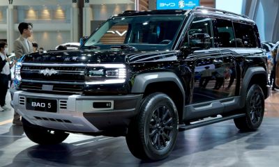 Black SUV with modern LED headlights and rugged body design