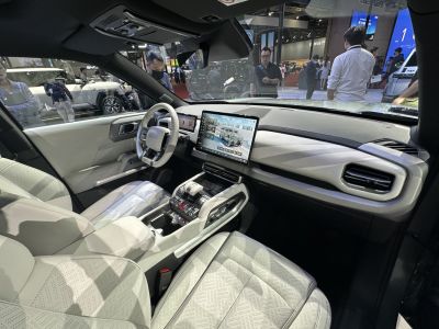 Modern car interior with digital dashboard and large touchscreen display