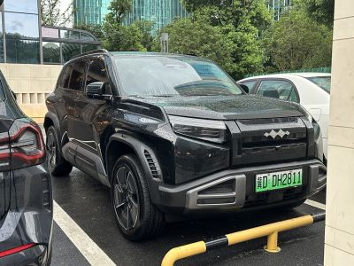 Black SUV with angular LED headlights and robust front bumper design