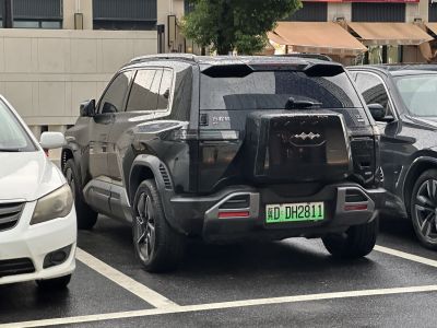Rear of electric SUV with spare tire cover and LED tail lights