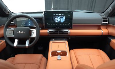 Digital dashboard and orange leather interior with large infotainment screen
