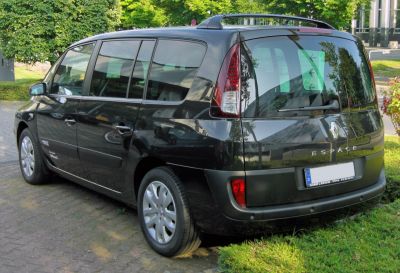 Rear and side view of black minivan with panoramic windows and roof rails