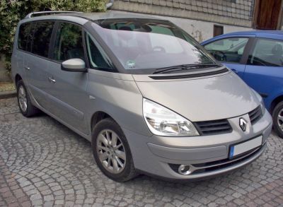 Silver MPV with large headlights and front grille