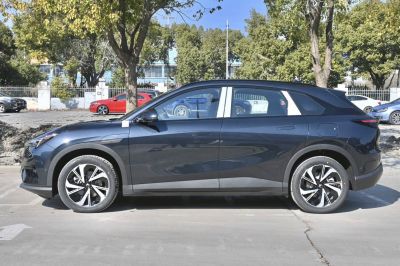 Electric SUV with aerodynamic shape, flush door handles, and stylish alloy wheels
