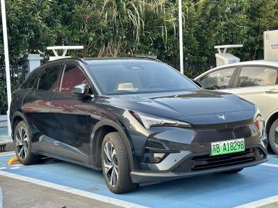 Sleek electric SUV front with LED headlights and aerodynamic shape