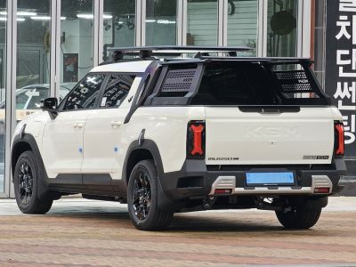 Pickup truck with unique rear tailgate, vertical taillights, and a roof rack