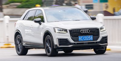 White SUV front view with LED headlights and black grille