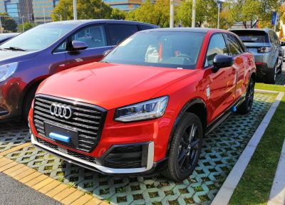 Front view with signature Audi grille and LED headlights