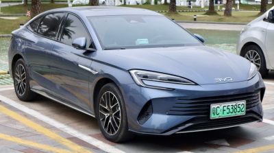 Electric sedan front and side profile with LED headlights and aerodynamic design