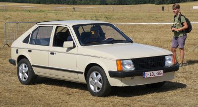 Vintage beige hatchback with rectangular headlights and black trim
