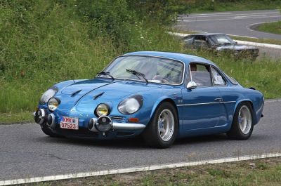 Front end of a classic blue coupe with multiple rally-style fog lights