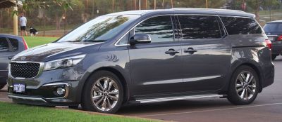 Side profile of a 2015 MPV with alloy wheels and modern grille