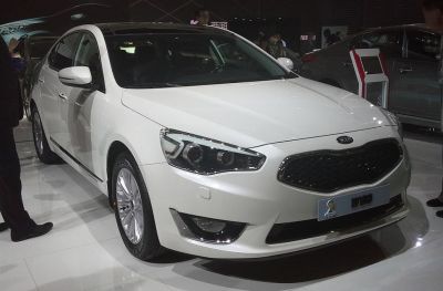 Front view of a modern sedan with distinctive headlights and grille