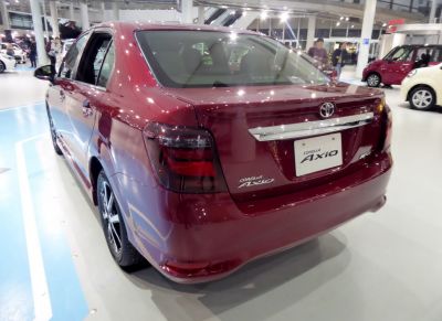 Rear design and taillights of a maroon sedan