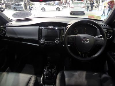 Dashboard and steering wheel interior view with center console and controls.