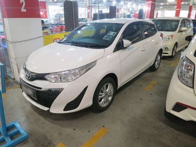 White hatchback with facelift headlights and black grille