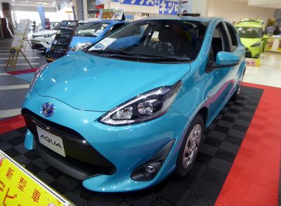 Compact hatchback with sleek headlights and refreshed front design.