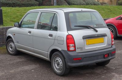 Compact hatchback rear and side view, steel wheels, rear wiper