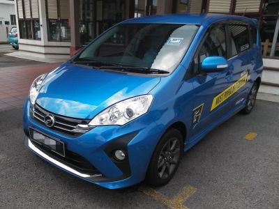 Blue MPV front-side view with modern headlights and alloy wheels