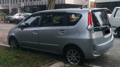 Silver silver MPV side and rear with vertical taillights and five-spoke alloy wheels.