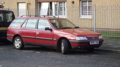 Front-side view of a station wagon with roof rails and extended rear cargo area