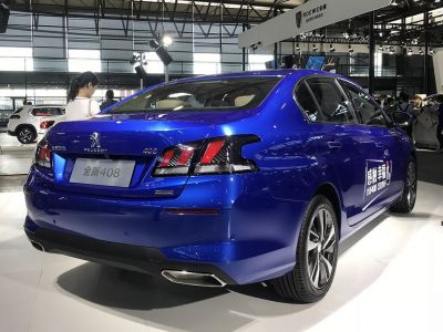 Rear view of 2018 sedan with distinct tail lights and dual exhaust tips