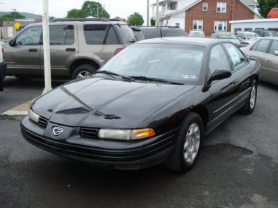 Black 1993 sedan with distinctive front grille and headlights