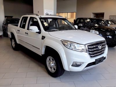 Front angled view of double cab pickup with chrome grille and LED lights