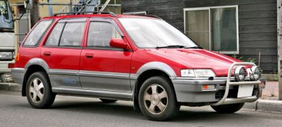Red two-tone wagon with front bull bar and off-road lights