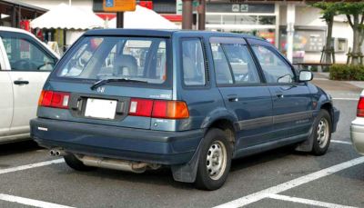 Rear view of 1988 station wagon with boxy shape and dual exhaust pipes