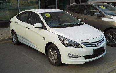 White 2015 sedan with updated grille and headlights