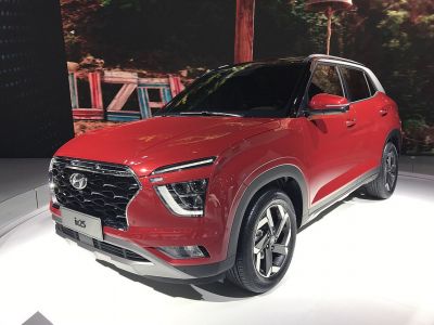 SUV with LED lights and hexagonal grille, unique wheel rims