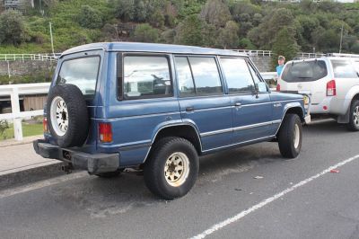 1989 rugged off-road SUV with rear-mounted spare tire and large side windows
