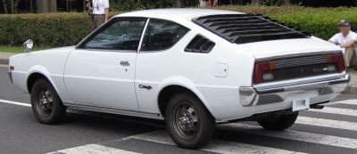 Classic coupe with rear window louvers and sleek side profile