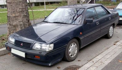 Four-door sedan with rectangular headlights and black exterior