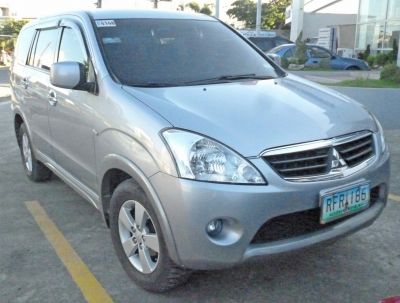 Silver SUV front angle with headlights and grille