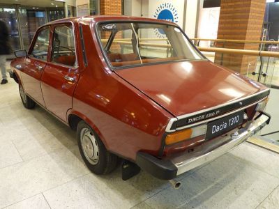 Rear view of a classic 1984 sedan with vintage taillights and chrome bumper
