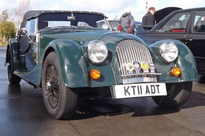 Front view with rounded headlights and wire spoke wheels