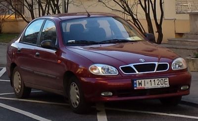 Front angled view with distinctive grille and headlight design
